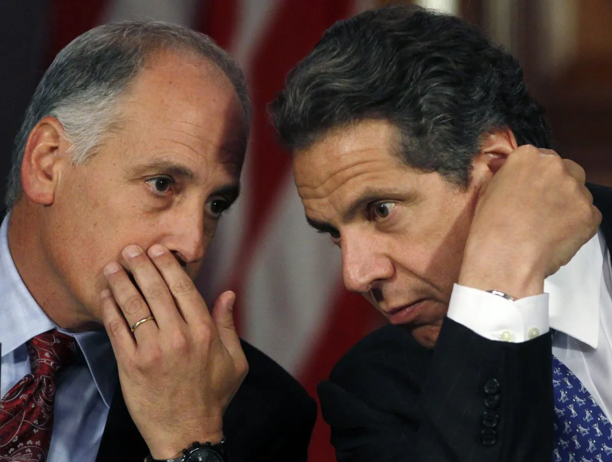 Larry Schwartz (L) secretary to the governor, talks to New York Gov. Andrew Cuomo during a cabinet meeting at the Capitol in Albany, N.Y., on Wednesday, May 9, 2012. (Mike Groll/Associated Press)