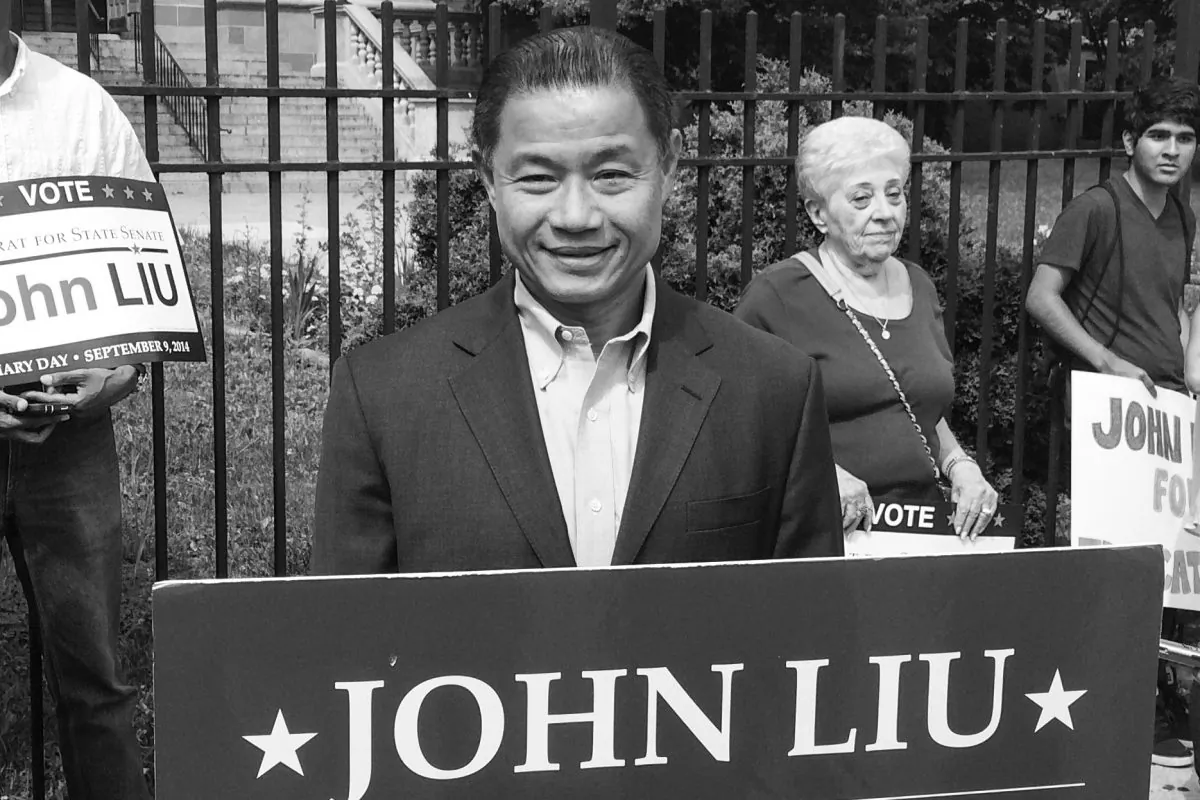 State Senate candidate John Liu and campaign staffers at the gates of Bayside High School in Queens, New York City, on Aug. 1, 2014. (Jonathan Zhou/Epoch Times)