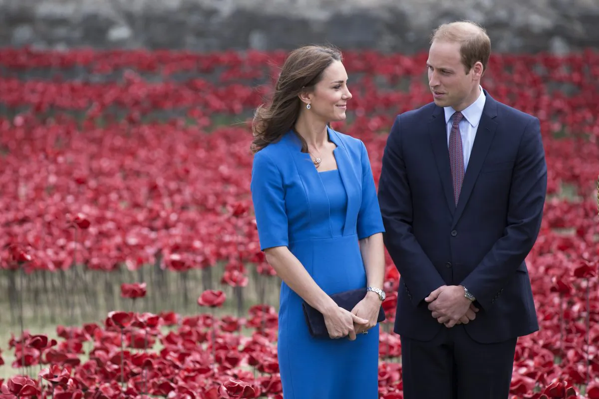 Catherine, Duchess of Cambridge and Prince William, Duke of Cambridge walk through an installation entitled 'Blood Swept Lands and Seas of Red' by artist Paul Cummins, made up of 888,246 ceramic poppies in the moat of the Tower of London, to commemorate the First World War on August 5, 2014 in London, England. (Oli Scarff/Getty Images)