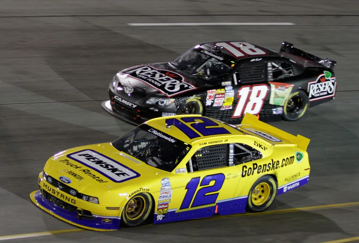 Sam Hornish Jr., driver of the #12 Penske Truck Rental Ford, leads Matt Kenseth, driver of the #18 Reser's Toyota, during the NASCAR Nationwide Series Virginia 529 College Savings 250 at Richmond International Raceway on September 6, 2013 in Richmond, Virginia. (Jerry Markland/Getty Images)