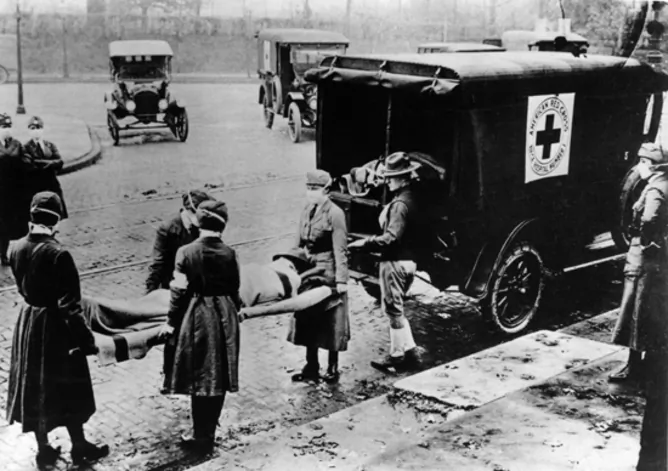 The pandemic flu virus spread around the world in several waves, causing illness in 20% to 50% of infected people and death in 1% to 5%. (British Red Cross/Flickr, CC BY-SA)