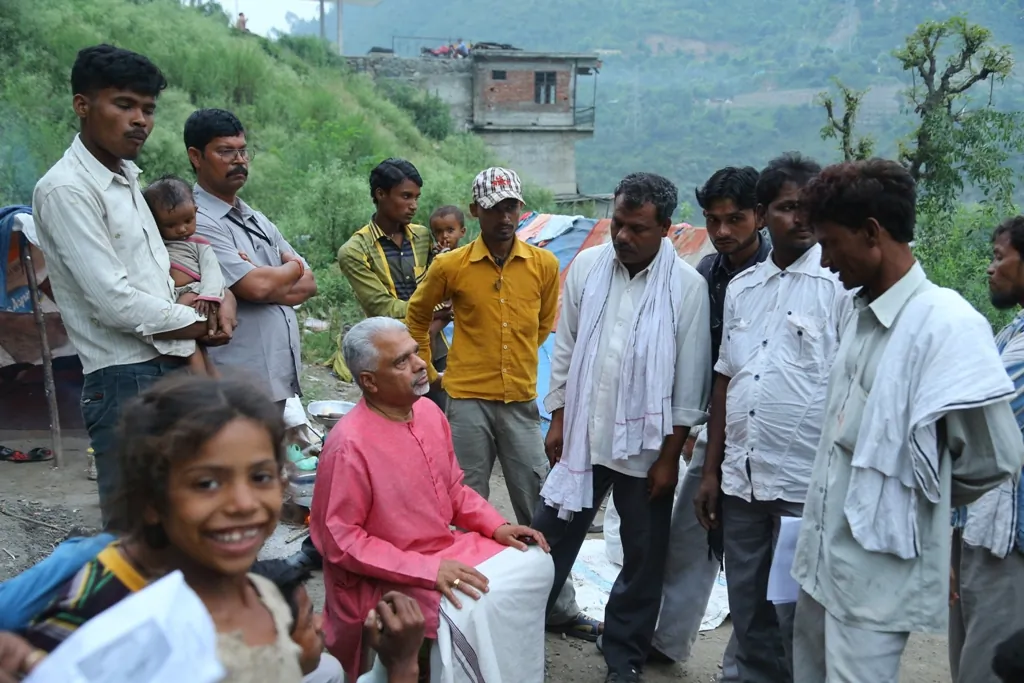Lawyer, Activist Sarachandra Bose and a group of volunteers interact with villagers in central India while on travel around the country on 26 July 2014. Bose travelling around the country for 55-days campaigning against caste. (Special arrangement)