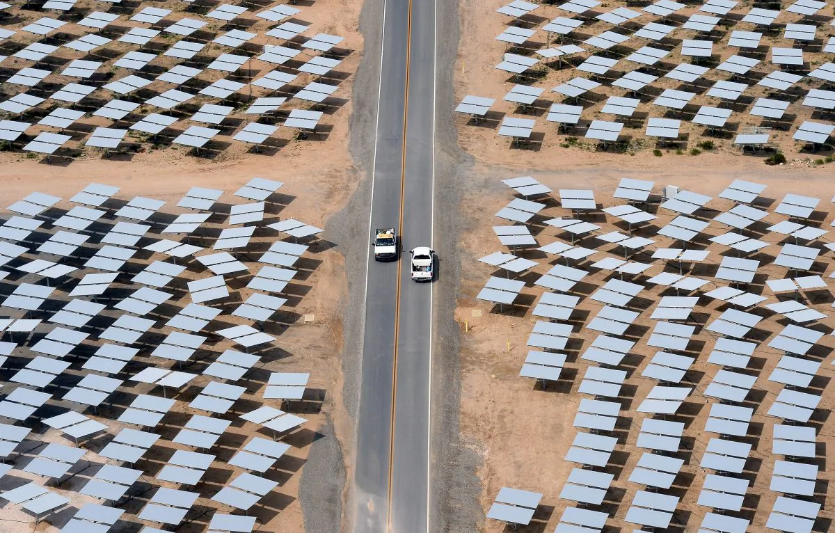 Vehicles travel on a road between rows of heliostats at the Ivanpah Solar Electric Generating System in the Mojave Desert in California on March 3, 2014. (Ethan Miller/Getty Images)