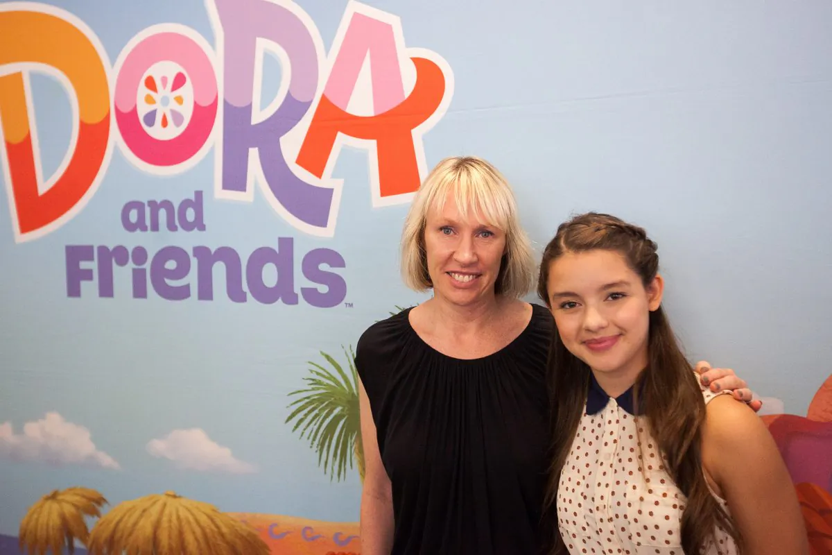 Fátima Ptacek (R), the voice of Dora from TV series "Dora the Explorer," and Valerie Walsh Valdes, co-creator of the show, pose for a picture at a screening of a spin-off show "Dora and Friends: Into the City," at Children's Museum of Manhattan, in New York, Aug. 10, 2014. (Petr Svab/Epoch Times)