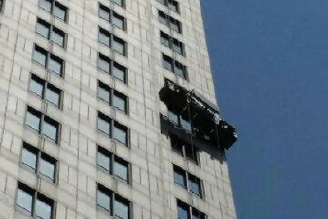 Two workers were rescued from the scaffolding on the 21st floor of a building in Manhattan, New York, on Monday, August 10, 2014. (New York Fire Department)