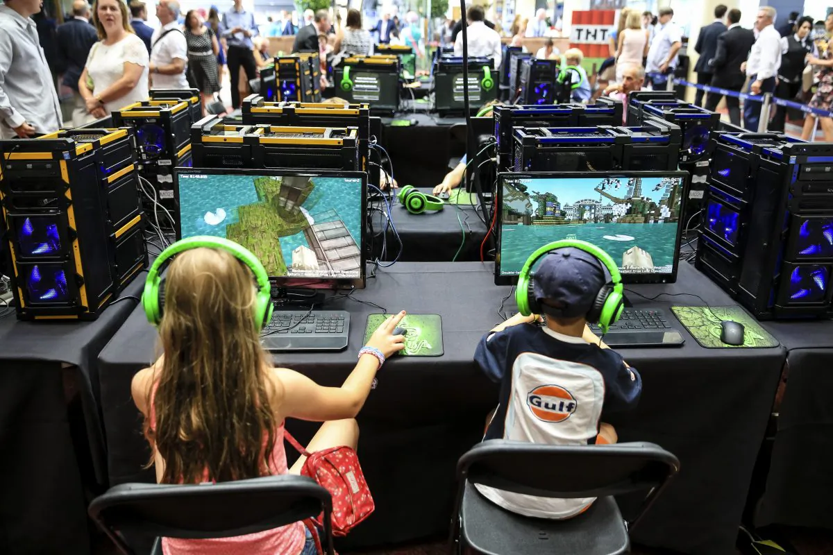 Young racegoers play in a Minecraft tournament at Ascot Racecourse in Ascot, England, on Aug. 9, 2014. (Miles Willis/Getty Images for Ascot Racecourse)