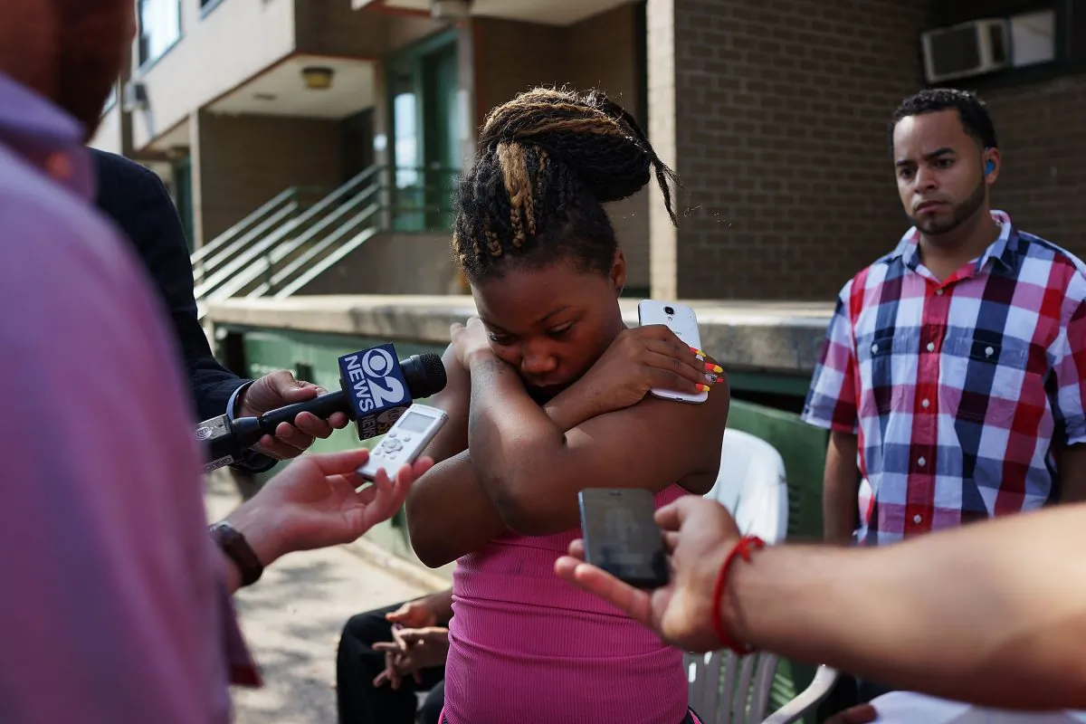 Cherisse Miller, the mother of Antiq Hennis, speaks to the media near where one-year-old Antiq was killed by a bullet meant for his father, in Brownsville, Brooklyn, New York, on Sept. 3, 2013. Mayor Bill de Blasio announced Wednesday the city will invest an additional $13 million into its anti-gun violence program. (Spencer Platt/Getty Images)
