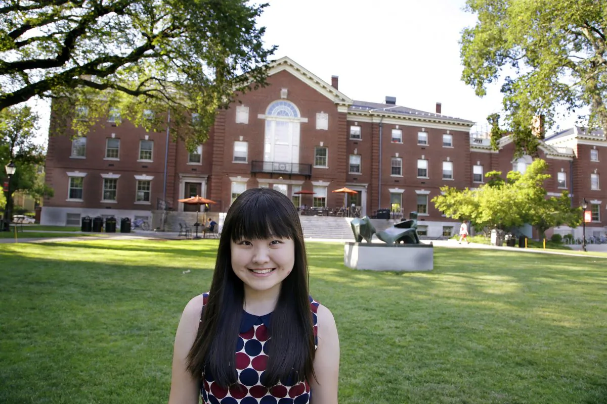 In this file photo, a high school student at the U.S. prep school Lawrence Academy in Groton, Mass., poses for a photo outside the Campus Center on the Brown University Campus in Providence, RI. (AP Photo/Stephan Savoia)