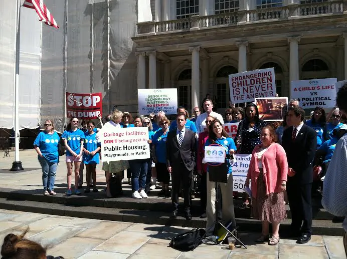 Officials and residents gather to protest the East 91st St. garbage station on the steps of City Hall, in New York, on August 14, 2014. (Amelia Pang/Epoch Times)