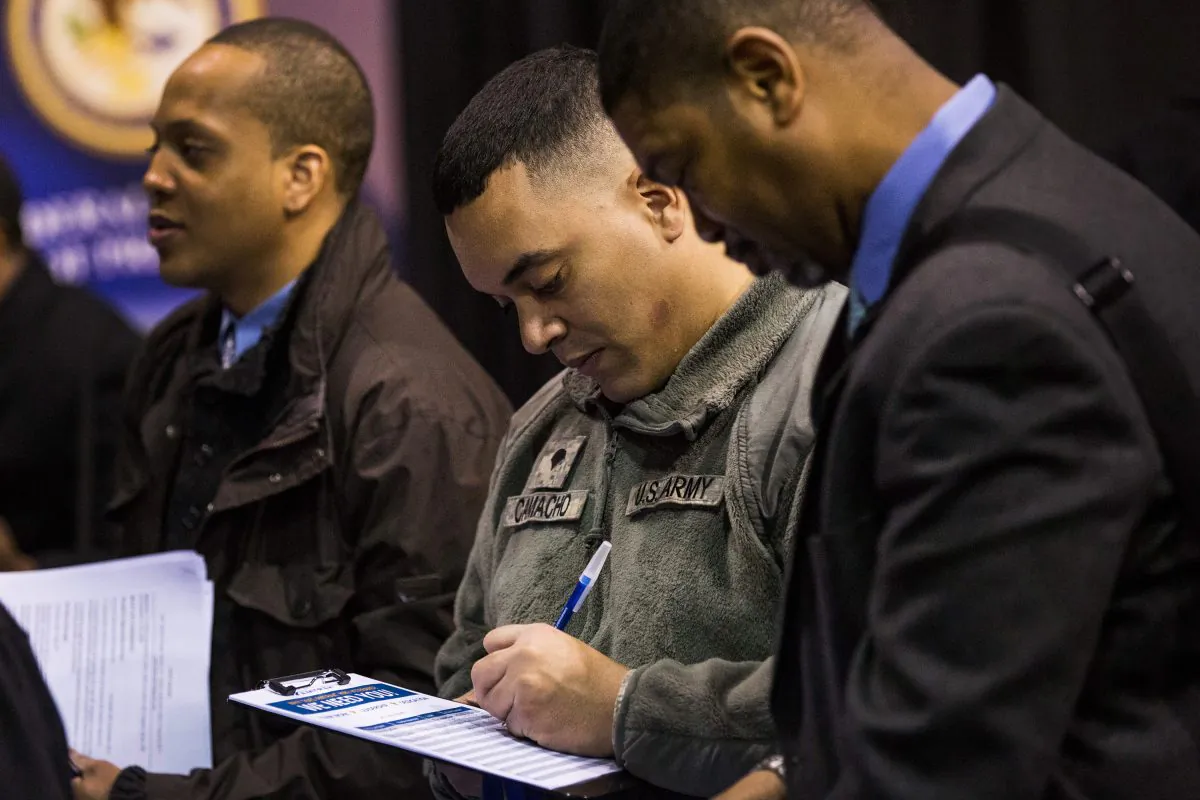 Veterans speak to a job recruiter at a 'Hiring our Heroes' Job Fair on March 27, 2014 in New York City. (Andrew Burton/Getty Images)
