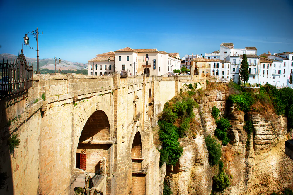 View of the old city of Ronda, the famous white village and the New Bridge. Province of Malaga, Andalusia, Spain. (*Shutterstock)