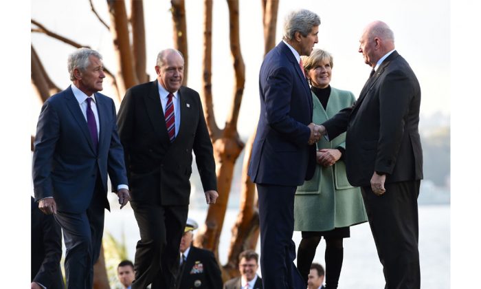 Secretary of State John Kerry (3rd-R), along with US Secretary of Defense Chuck Hagel (L), Australian Defense Minister David Johnston (2nd-L), and Australian Foreign Minister Julie Bishop (2nd-R) are greeted by Governor-General Sir Peter Cosgrove (R) at Admiralty House on Aug. 12, 2014 in Sydney, Australia. (Dan Himbrechts/Getty Images)