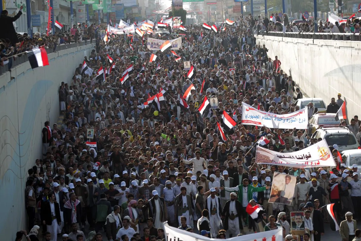 Yemeni protesters wave national flags and banners during a rally in the capital Sanaa on Feb. 8, 2014, marking the 3rd anniversary of the 2011 revolution that forced former President Ali Abdullah Saleh to step down. (Mohammed Huwais/AFP/Getty Images)