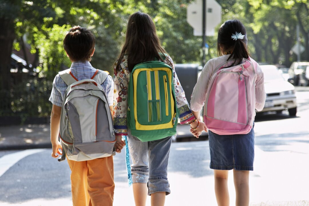 A major cause of back pain in children is due to carrying backpacks that are too heavy, too large, or not used properly. (Fuse/Thinkstock)