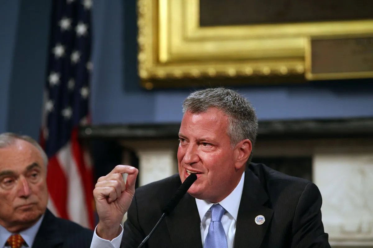 New York City Mayor Bill de Blasio (R) speaks as Police Commissioner Bill Bratton listens at a roundtable discussion on police-community relations on July 31, 2014. (Spencer Platt/Getty Images)