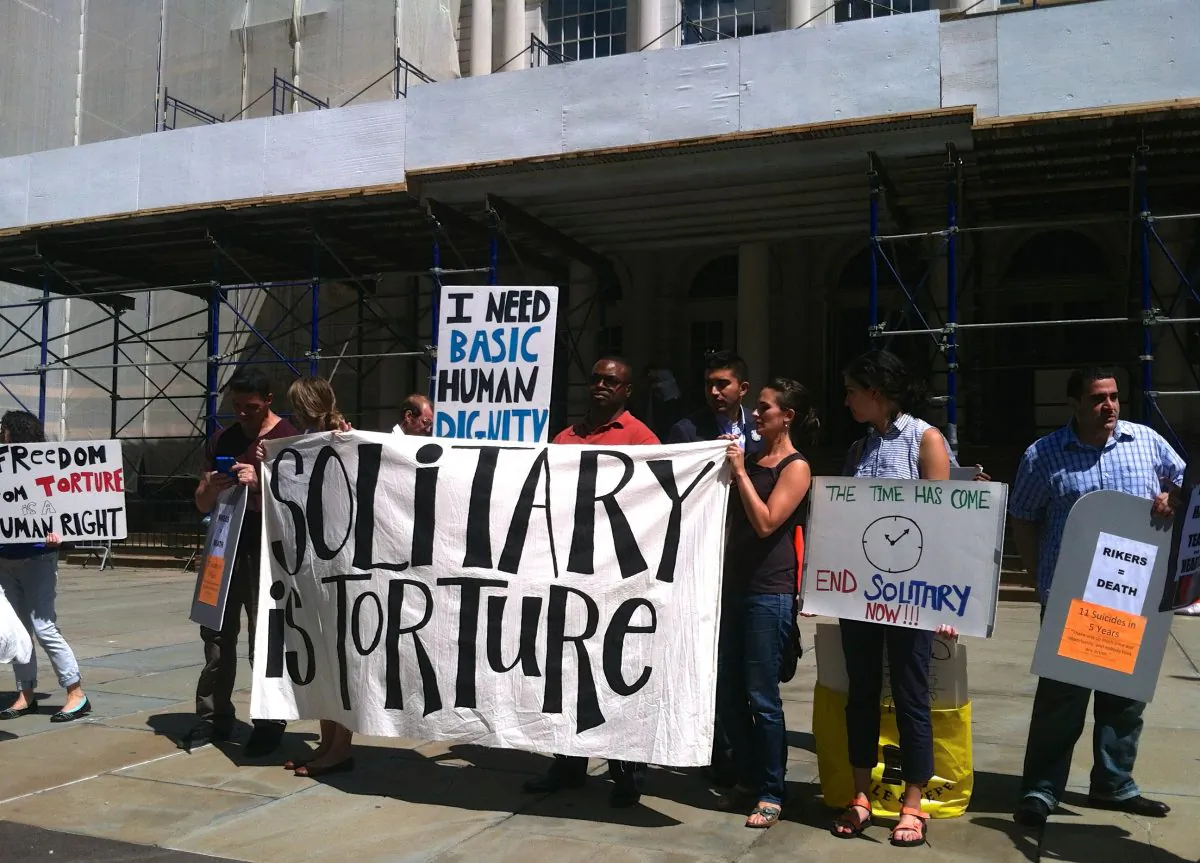 Advocates for better treatment of the incarcerated gather at City Hall in New York, on Monday, Aug. 18, 2014. The city council is expected to pass a bill this Thursday that will require city jails to submit regular reports on who they place in solitary confinement and whether they have a mental disability. (Annie Wu/Epoch Times)