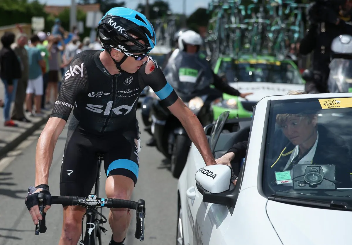Chris Froome of Team Sky receives medical attention after being crashing early in Stage Four of the 2014 Le Tour de France on July 8, 2014 in Le Touquet-Paris-Plage, France. (Doug Pensinger/Getty Images)