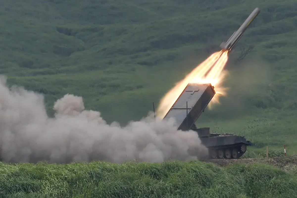 The Japan Ground Self-Defense Force's anti-landmine missile is launched during an annual live firing exercise at Higashi Fuji range in Gotemba, southwest of Tokyo, on Aug. 19, 2014. (AP Photo/Shizuo Kambayashi)