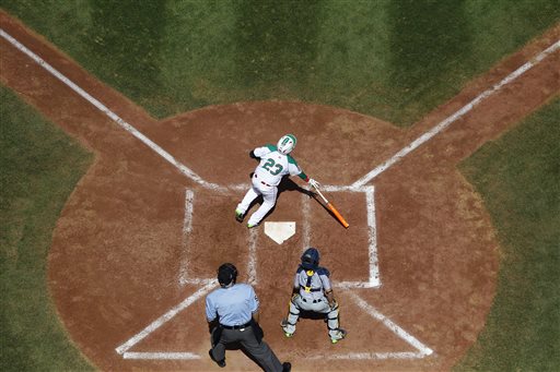 Mexicos Erick Vela (23) watches his three-run home run off Australias Callum Johnson during the fourth inning of an International elimination baseball game at the Little League World Series, Monday, Aug. 18, 2014, in South Williamsport, Pa. At bottom is Australias Daniel Stephenson and umpire Ron Roberts. Mexico won 6-2. (AP Photo/Matt Slocum)