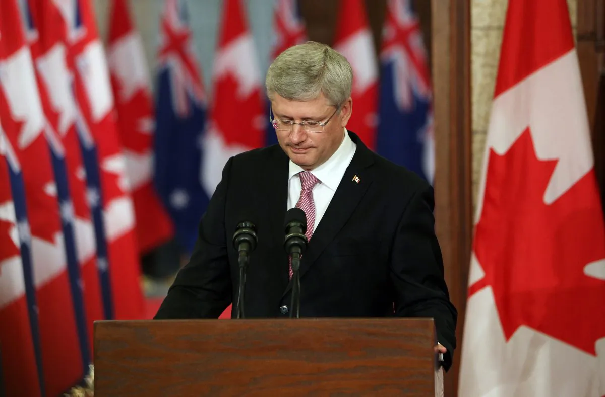 Canadian Prime Minister Stephen Harper pauses as he address the media alongside Australian Prime Minister Tony Abbott (not shown) on Parliament Hill in Ottawa, Canda, June 9, 2014. (Cole Burston/AFP/Getty Images)
