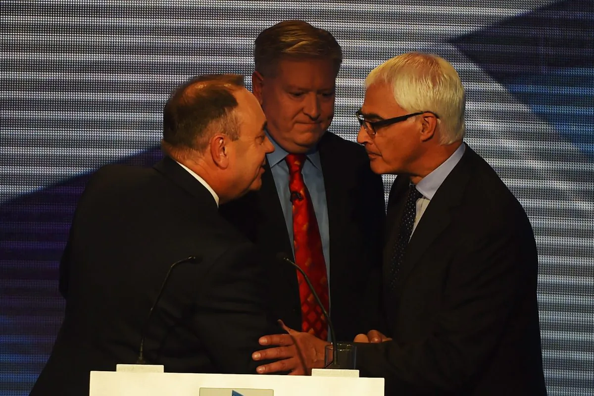 Alex Salmond (L) First Minister of Scotland and Alistair Darling (R) chairman of Better Together shake hands at the end of a live television debate hosted by Bernard Ponsonby at the Royal Conservatoire of Scotland on August 5, 2014 in Glasgow, Scotland. The two politicians are facing questions in front of 350 people during a live televised debate, they will try and influence voters before the referendum on 18th September when the nation will be asked to vote yes or no to decide whether Scotland should be an independent country. (Photo by Jeff J Mitchell/Getty Images)
