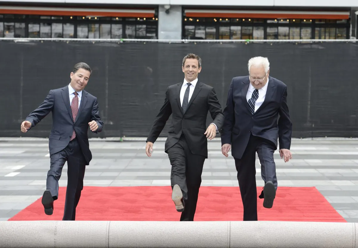 From left to right, Television Academy Chairman and CEO Bruce Rosenblum, host Seth Meyers, and executive producer Don Mischer roll out the red carpet at the Television Academy's 66th Primetime Emmy Awards Press Preview Day and Red Carpet Rollout at Nokia Theater L.A. LIVE on Wednesday, Aug. 20, 2014 in Los Angeles. (Photo by Dan Steinberg/Invision for the Television Academy/AP Images)