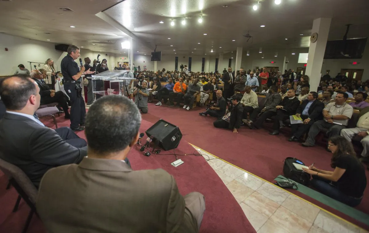 Los Angeles Police Chief Charlie Beck takes questions during a community forum on Aug. 19 in Los Angeles to discuss the police shooting of 25-year-old Ezell Ford. (AP Photo/Ringo H.W. Chiu)