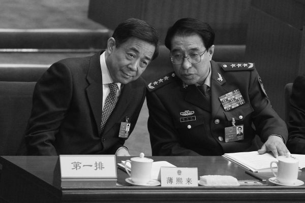 General Xu Caihou, then-Vice Chairman of the Communist Party of China's Central Military Commission, talks with China's Chongqing Municipality Communist Party Secretary Bo Xilai during the opening ceremony of the National People's Congress at the Great Hall of the People on March 5, 2012 in Beijing, China. Xu and Bo conspired to establish forced organ harvesting in Liaoning Province. (Feng Li/Getty Images)