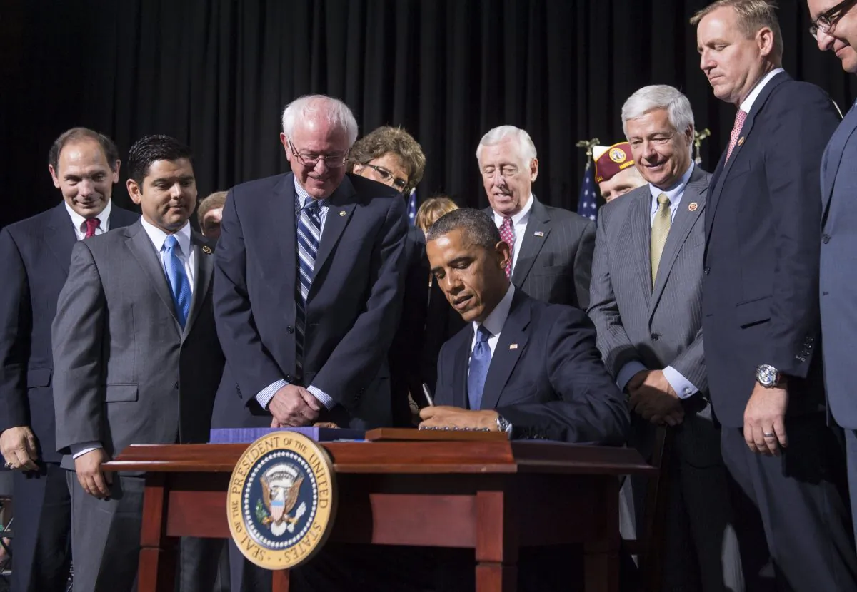 President Barack Obama signs House Resolution 3230, the Veterans Access to Care through Choice, Accountability, and Transparency Act of 2014, at Fort Belvoir in Virginia on Aug. 7, 2014. (Saul Loeb/AFP/Getty Images)
