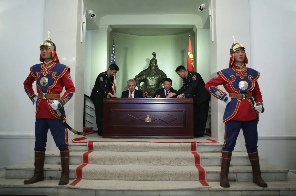 US Secretary of Defense Chuck Hagel (L) and Mongolian Defense Minister Dashdemberal Bat-Erdene (R) participate in a signing ceremony of a joint vision statement at the Mongolian Ministry of Defense on April 10, 2014, in Ulaanbaatar, Mongolia. Mongolia has in recent years sought closer ties and cooperation in security matters with the United States. (Alex Wong/Getty Images)