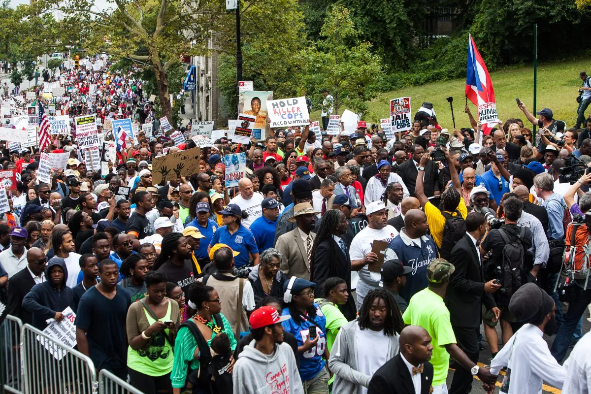 A march on Staten Island, Aug. 23, 2014, for Eric Garner, a man killed July 17 when a policeman put him in a chokehold, and against police brutality. (Petr Svab/Epoch Times)