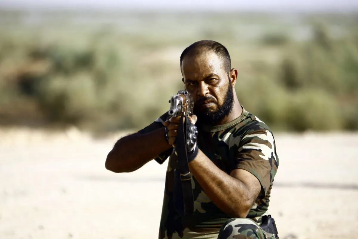 A Shiite Muslim fighter, loyal to Iraqi Shiite cleric Moqtada al-Sadr, takes part in a last combat training near the city of Najaf on Aug. 23, 2014, before joining the government forces to fight Islamic State (IS) jihadists in the Jurf al-Sakhr area, south of Baghdad. (Haidar Hamdani/AFP/Getty Images)