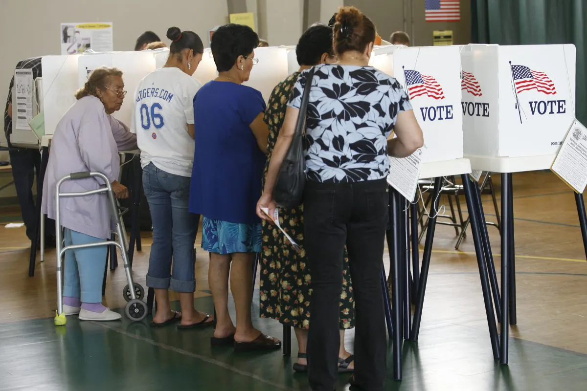 In this June 6, 2006 file photo, voters cast their ballots in the California primary election in Los Angeles. (AP Photo/Damian Dovarganes)