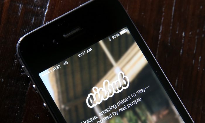A smartphone displaying the Airbnb app. (Justin Sullivan/Getty Images) 