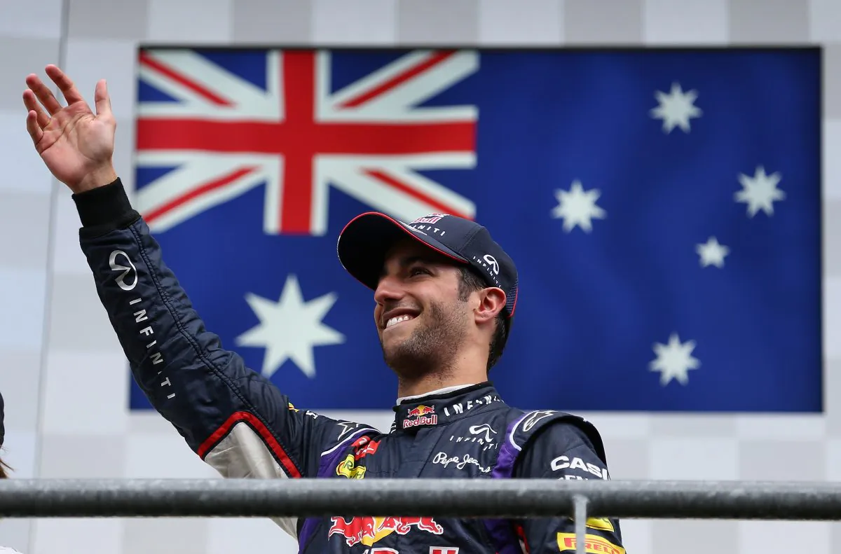Daniel Ricciardo of Red Bull Racing celebrates on the podium after winning the Belgian Grand Prix at Circuit de Spa-Francorchamps on August 24, 2014 in Spa, Belgium. (Clive Mason/Getty Images)
