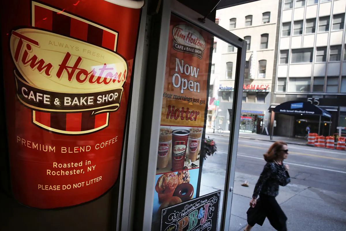 A person walks past a Tim Horton's cafe in Manhattan on Monday. (Spencer Platt/Getty Images)