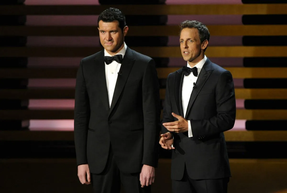 Billy Eichner, left, and Host Seth Meyers speak on stage at the 66th Annual Primetime Emmy Awards at the Nokia Theatre L.A. Live on Monday, Aug. 25, 2014, in Los Angeles. (Photo by Chris Pizzello/Invision/AP)