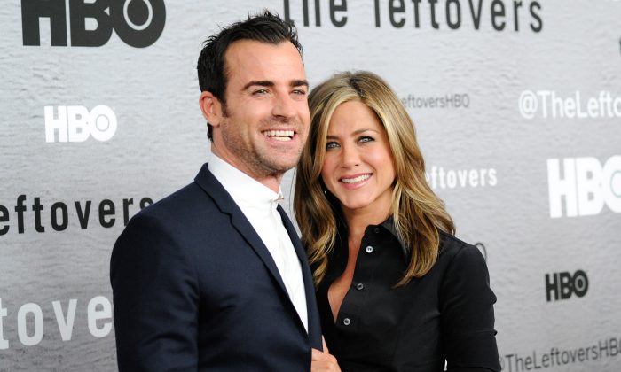 Actors Justin Theroux and Jennifer Aniston attend HBO's "The Leftovers" season premiere at the NYU Skirball Center on Monday, June 23, 2014 in New York. (Photo by Evan Agostini/Invision/AP)