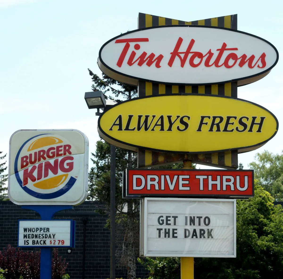 Burger King and Tim Hortons locations in close proximity in Ottawa, Canada. (AP Photo/The Canadian Press, Sean Kilpatrick)