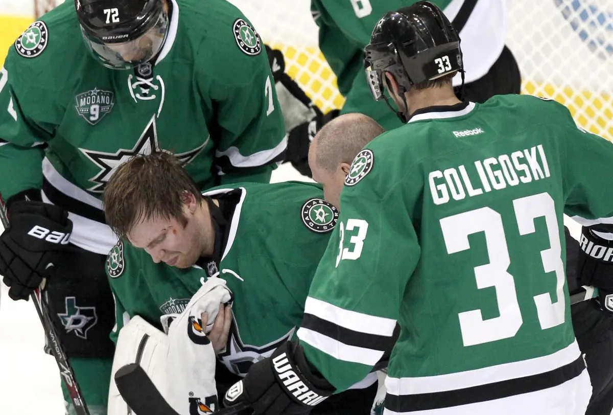 Kari Lehtonen of the Dallas Stars incurs a concussion while playing against the Minnesota Wild on March 8, 2014, at the American Airlines Center in Dallas. The Canadian Concussion Collaborative says all sports organizations in Canada should implement a concussion management protocol. (Thomas B. Shea/Getty Images)