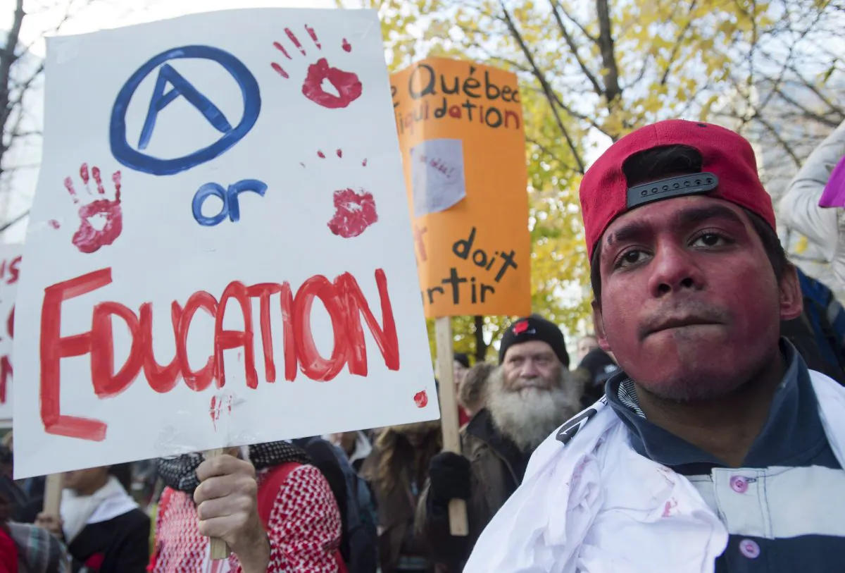 Demonstrators march in the streets of downtown Montreal to protest a proposed tuition fee hike, Nov. 22, 2012. Canadians are becoming increasingly concerned about the ever-rising costs of post-secondary education and who will pay for them, according to several new polls. (The Canadian Press/Graham Hughes)