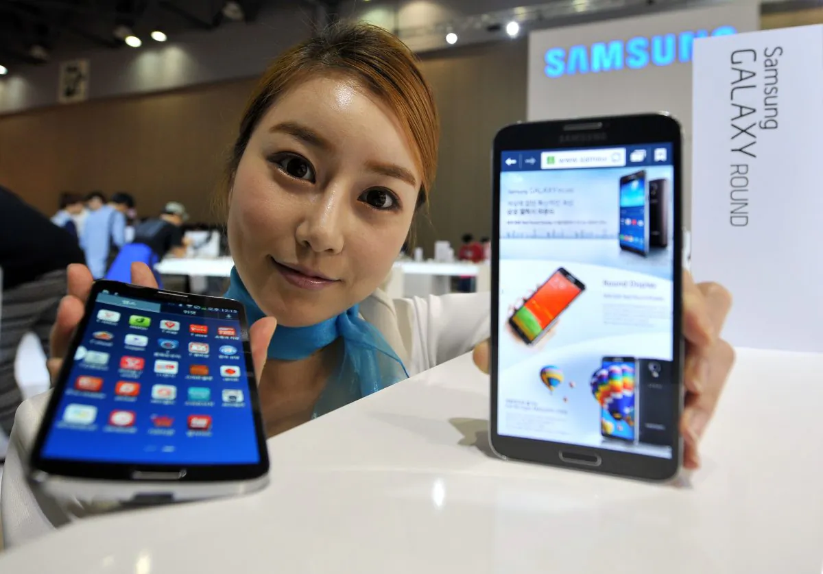 A model holds some electronics by Samsung. South Korean electronic giant Samsung proclaims its ambition to fuel the Internet of Things era. (JUNG YEON-JE/AFP/Getty Images)