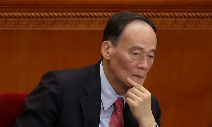 Anti-corruption chief Wang Qishan attends the opening session of the National People's Congress (NPC) at the Great Hall of the People on March 5, 2014 in China. (Feng Li/Getty Images)