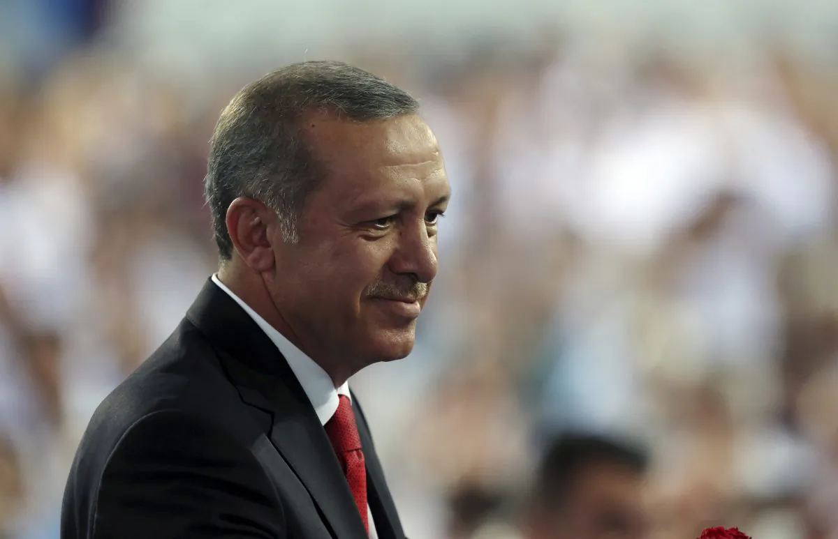 President-elect Recep Tayyip Erdogan addresses his supporters in Ankara, Turkey, Wednesday, Aug. 27, 2014. (AP Photo/Burhan Ozbilici)