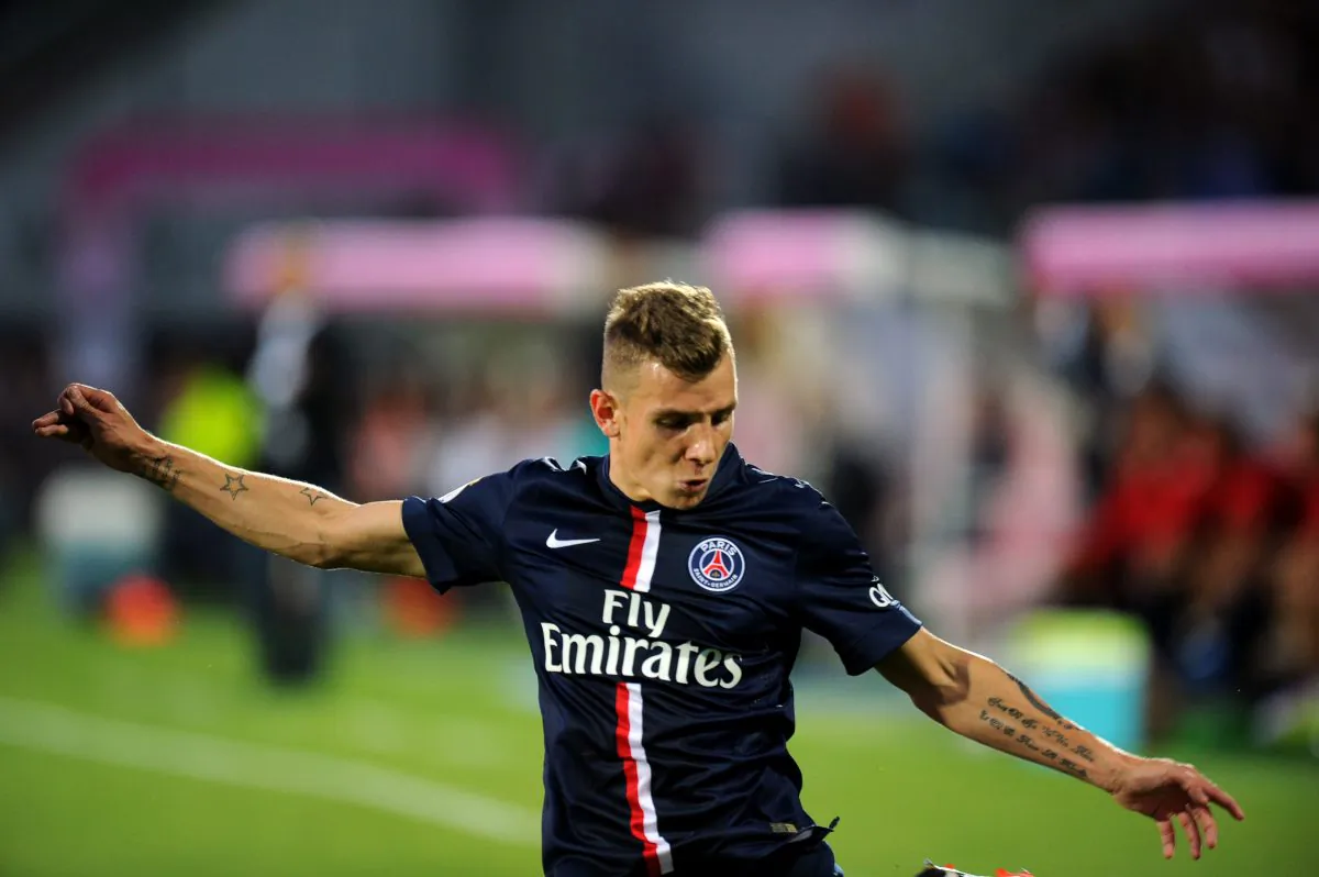 Paris Saint-Germain's French defender Lucas Digne vies for the ball during the French L1 football match between Evian Thonon Gaillard (ETGFC) and Paris Saint-Germain (PSG) on August 22, 2014 at the Parc des Sport in Annecy, southeastern France. (JEAN-PIERRE CLATOT/AFP/Getty Images)