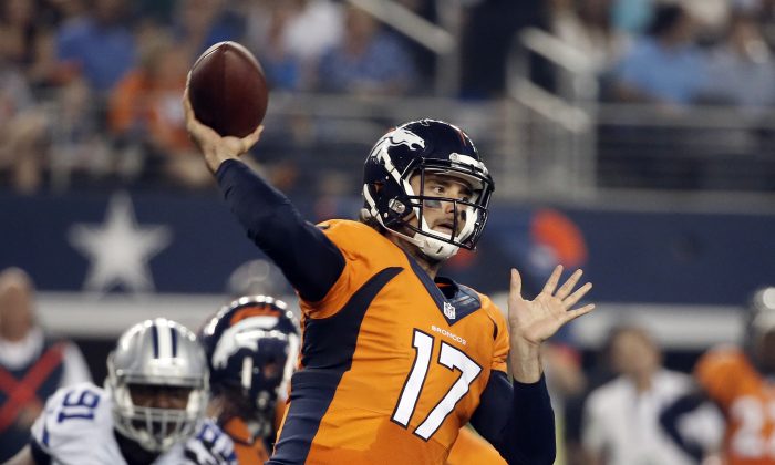 Denver Broncos quarterback Brock Osweiler (17) passes under pressure from Dallas Cowboys' Kenneth Boatright (91) in the first half of a NFL preseason football game, Thursday, Aug. 28. 2014, in Arlington, Texas. (AP Photo/Brandon Wade)