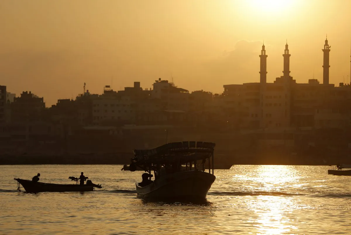 Palestinian fishermen sail their boats at Gaza's seaport in Gaza City early on August 29, 2014. Israel and Hamas accepted an Egyptian proposal for a long-term ceasefire in war-torn Gaza on August 26 in a move to end 50 days of bloodshed. Restrictions imposed on Gaza fishermen are to be relaxed, with an immediate extension of the fishing zone to six nautical miles from the shore, to be extended later to 12 miles. (Mohammed Abed/AFP/Getty Images)
