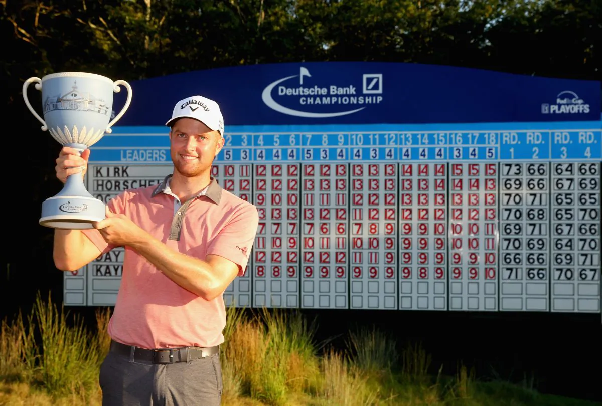 Chris Kirk is presented with the winner's trophy after winning the Deutsche Bank Championship at the TPC Boston. (Jim Rogash/Getty Images) 