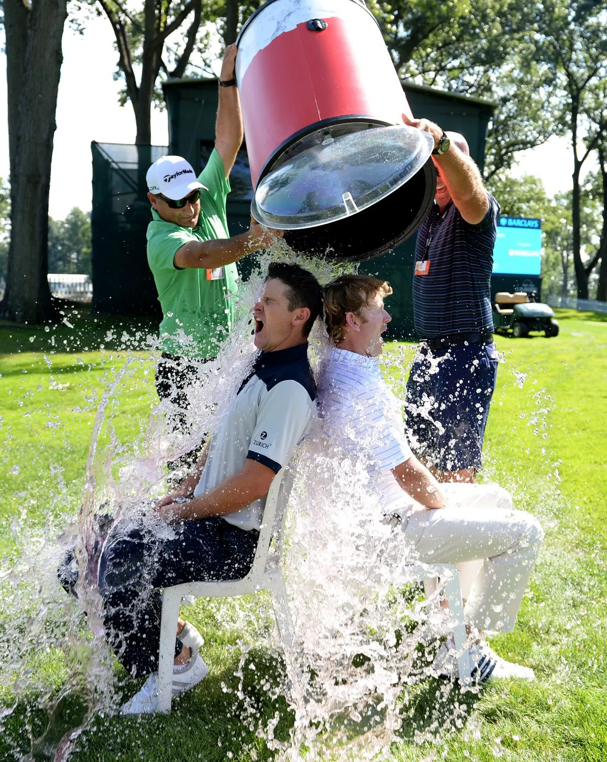 Justin Rose of England and Brandt Snedeker of the USA take the Ice Bucket Challenge prior to The Barclays in Paramus, N.J., on Aug. 19, 2014. (Ross Kinnaird/Getty Images)