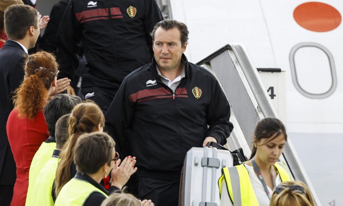 The head coach of the Belgian national football team, Marc Wilmots, arrives on July 7, 2014 with players at Brussels Airport in Zaventem after Belgium was eliminated by Argentina on July 5 from the 2014 FIFA World Cup in Brazil. (THIERRY ROGE/AFP/Getty Images)